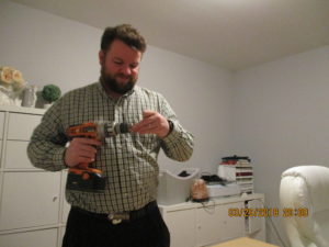 hubby putting together computer desk